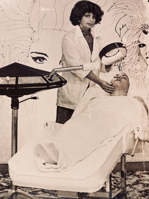 Daisy, Founder of Daisy MD Care, performing a facial treatment in 1979